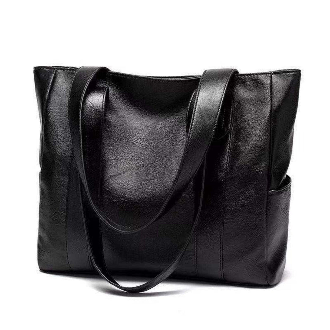 "Women's vintage leather shoulder bag, large capacity, sleek silhouette, elegant brown finish, perfect for daily use."