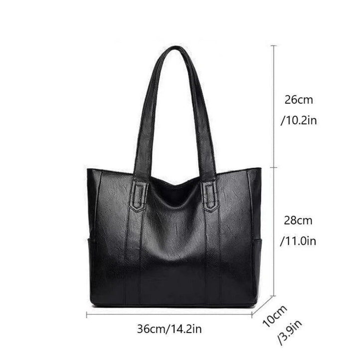 "Women's vintage leather shoulder bag, large capacity, sleek silhouette, elegant brown finish, perfect for daily use."