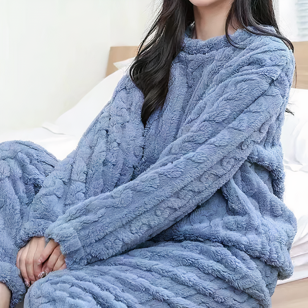 "Women's warm fleece pajama set in gray, showcasing cozy sleepwear ideal for cold nights with a relaxed fit and soft fabric."
