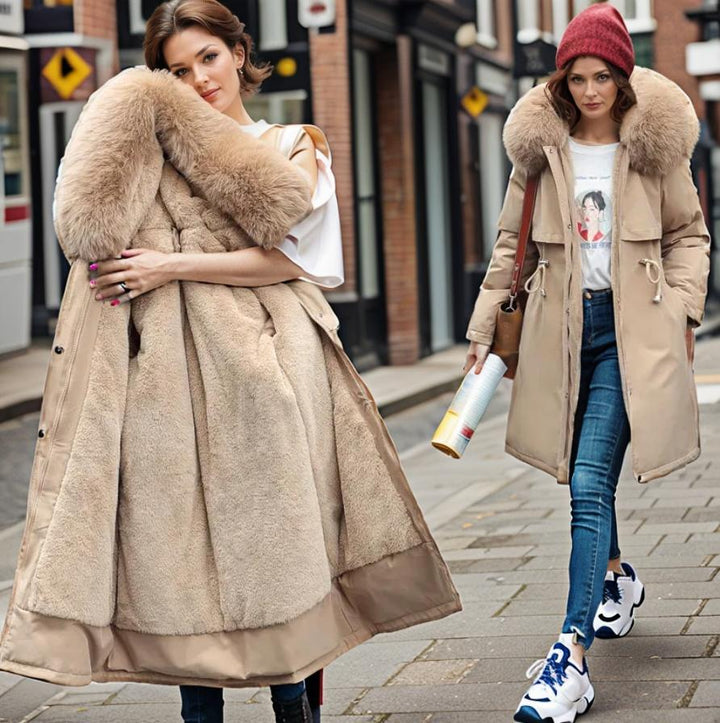 Women's warm waterproof winter coat, modern fit, sleek design, with hood and adjustable cuffs for wet conditions.