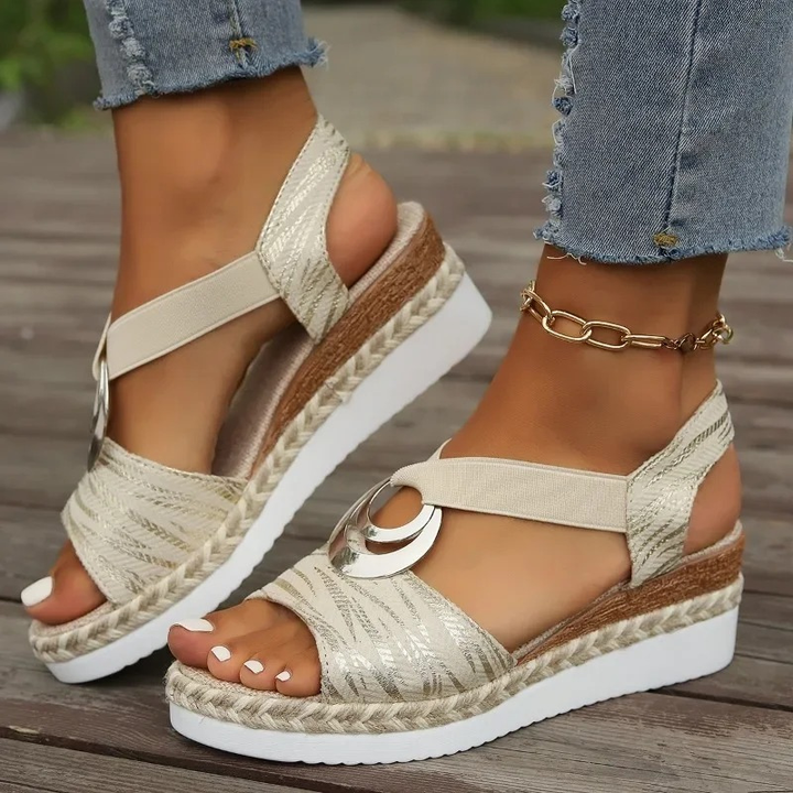 Women's wedge sandals with decorative ring, adjustable strap. Stylish, comfortable, and versatile footwear for any occasion.