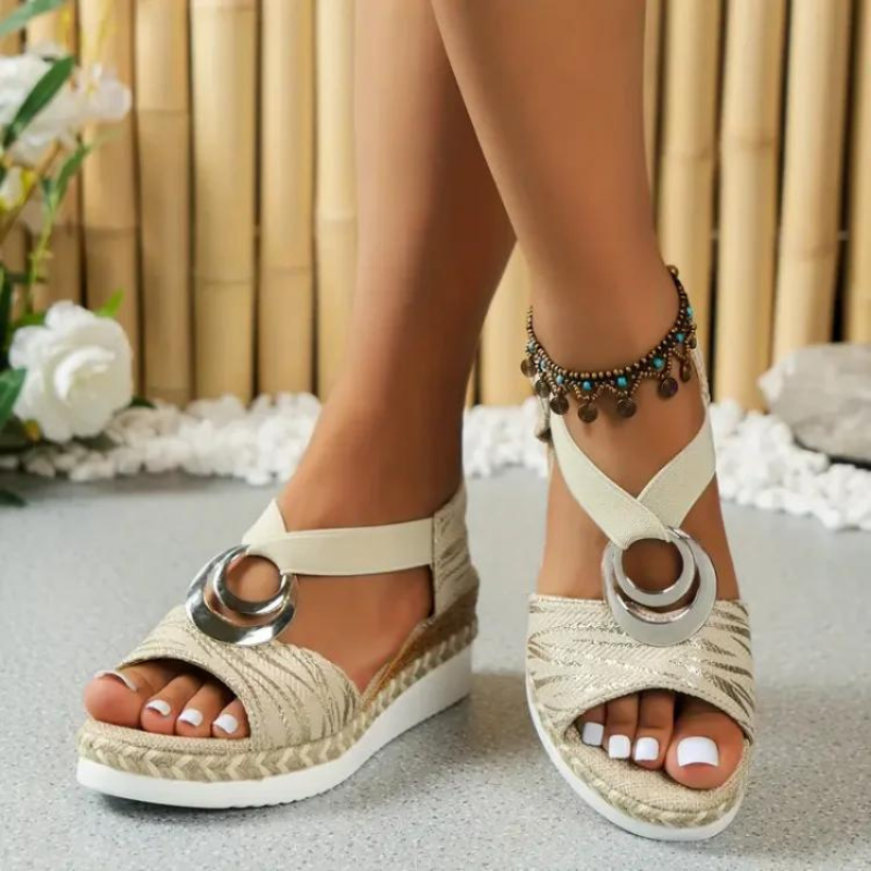 Women's wedge sandals with decorative ring, adjustable strap. Stylish, comfortable, and versatile footwear for any occasion.