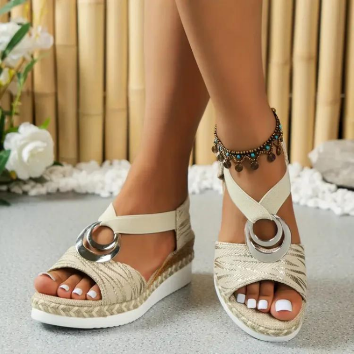 Women's wedge sandals with decorative ring, adjustable strap. Stylish, comfortable, and versatile footwear for any occasion.