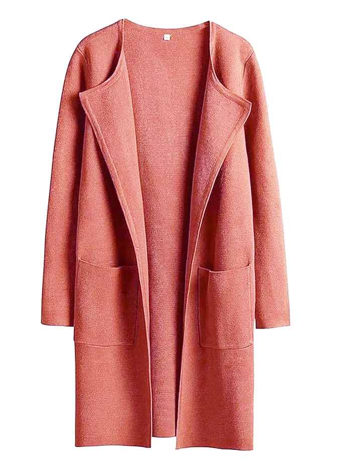 "Women's wool blend knee-length coat with wide lapel and patch pockets, showcasing a relaxed fit and minimalist design."