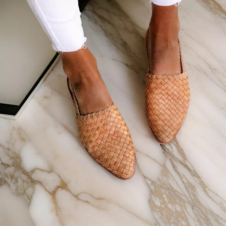 Women's woven leather sandals with slingback, featuring a hand-woven design and cushioned sole for all-day comfort.