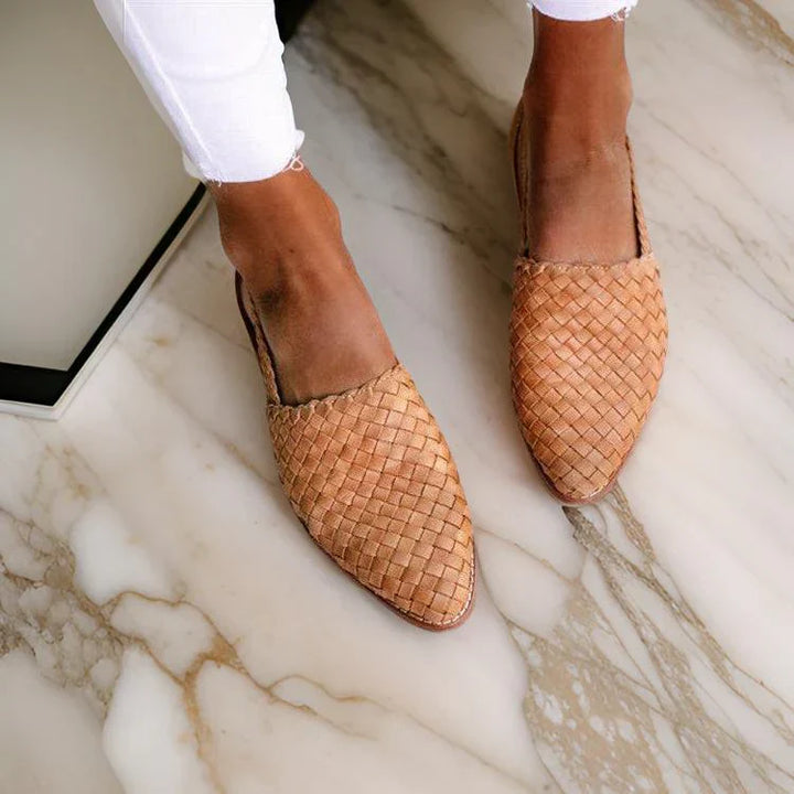 Women's woven leather sandals with slingback, featuring a hand-woven design and cushioned sole for all-day comfort.